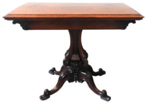 AN EARLY VICTORIAN CARD TABLE, CIRCA 1850, the pivoting rectangular fold-over top opens to reveal