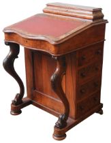 A MID VICTORIAN WALNUT DAVENPORT, CIRCA 1870, cushion form compartmented stationary storage above