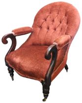 A LATE VICTORIAN MAHOGANY NURSING CHAIR, CIRCA 1870, with button upholstered arch back, covered in a