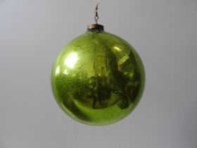 A LARGE GREEN WITCHES BALL, the mercury now degraded. 25 cms diam. Provenance: from the Private