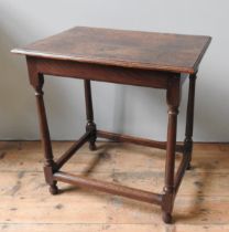 A GEORGE III OAK SIDE TABLE, CIRCA 1770, rectangular moulded edge top over tapering ring turned legs