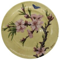 A VINTAGE THEODORE DECK PLATE, CIRCA 1910, hand painted with a cherry blossom design on a pale
