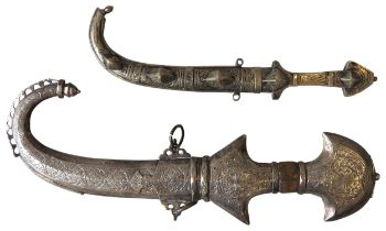 A LARGE AND ORNATE JAMBIYA WITH WHITE METAL HILT AND CURVED SCABBARD AND ANOTHER JAMBIYA. 45 cms max