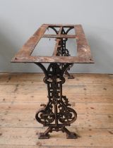 A 19TH CENTURY CAST-IRON TABLE BASE, the two foliate and bird decorated end trestle ends united by a