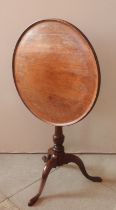 A GEORGE III MAHOGANY TRIPOD TABLE, CIRCA 1800, circular galleried tilting top on a a turned