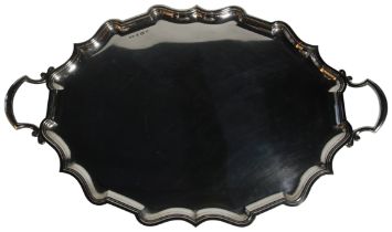 A massive silver two handled tray with shaped borders & handle. Birmingham 1904 (L: 78cm, W: