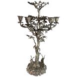 A massive six light silver candelabrum in the form of an oak tree with vase type sockets & 2
