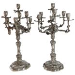 A good pair of German silver seven branch candelabrum with scrolled bases. Maker (Elimeyer