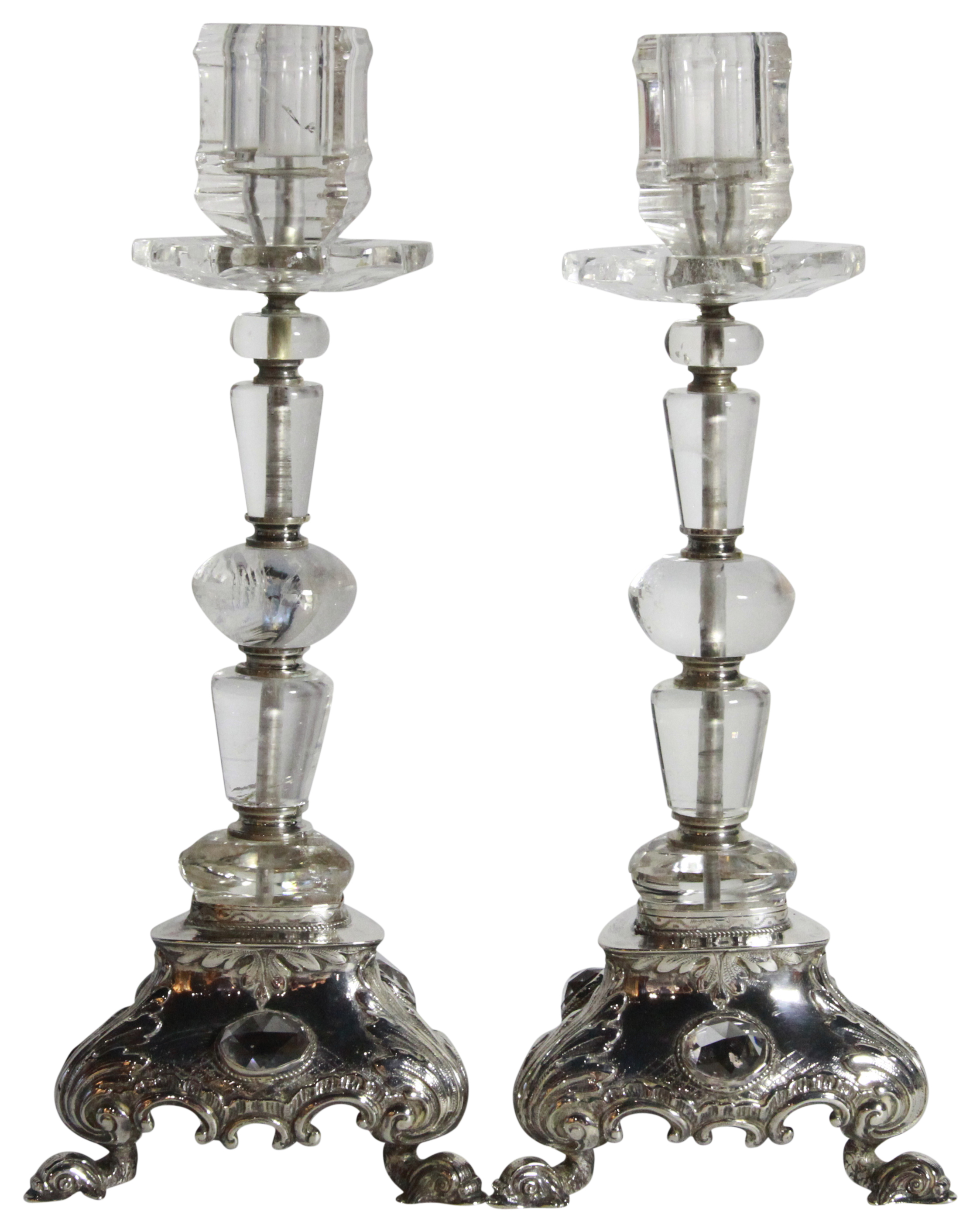 A pair of German Montain crystal candlesticks upon silver bases also with facit glass stone