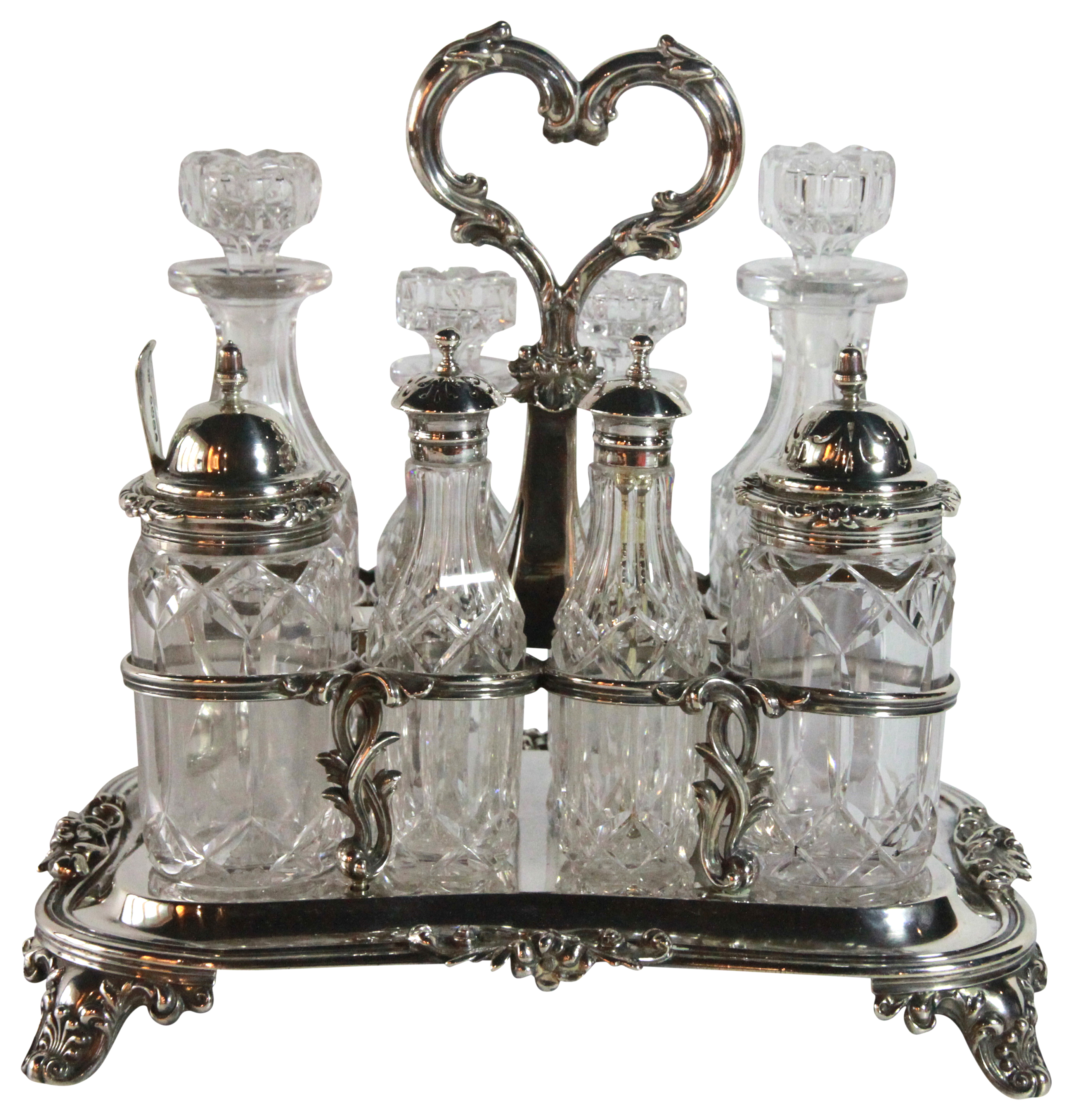 A Victorian silver & glass cruet set. 8 cruets upon a silver base - Rawlings & Summers 1839, (L: