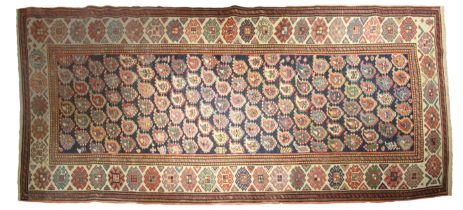 A good Talish floor carpet, central panel of rosettes on cream borders, late 19th century. (L: 250