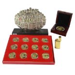 A Selection of 12 New Years decorative Chinese coins cased, also one other cased coin from Macau