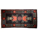 A good Chinese antique rug, blue ground decorated with urns of foliage red lotus. (L: 168 cm, L: