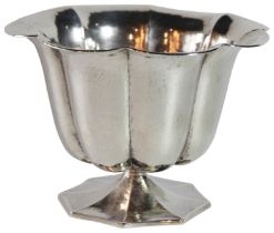 A German silver scalloped shaped bowl upon an octagonal base. 754 grams - (18cm Diameter)