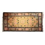 A good Caucasian yellow ground rug with stylised flowers with blue border, (L: 160cm, W: 80 cm)