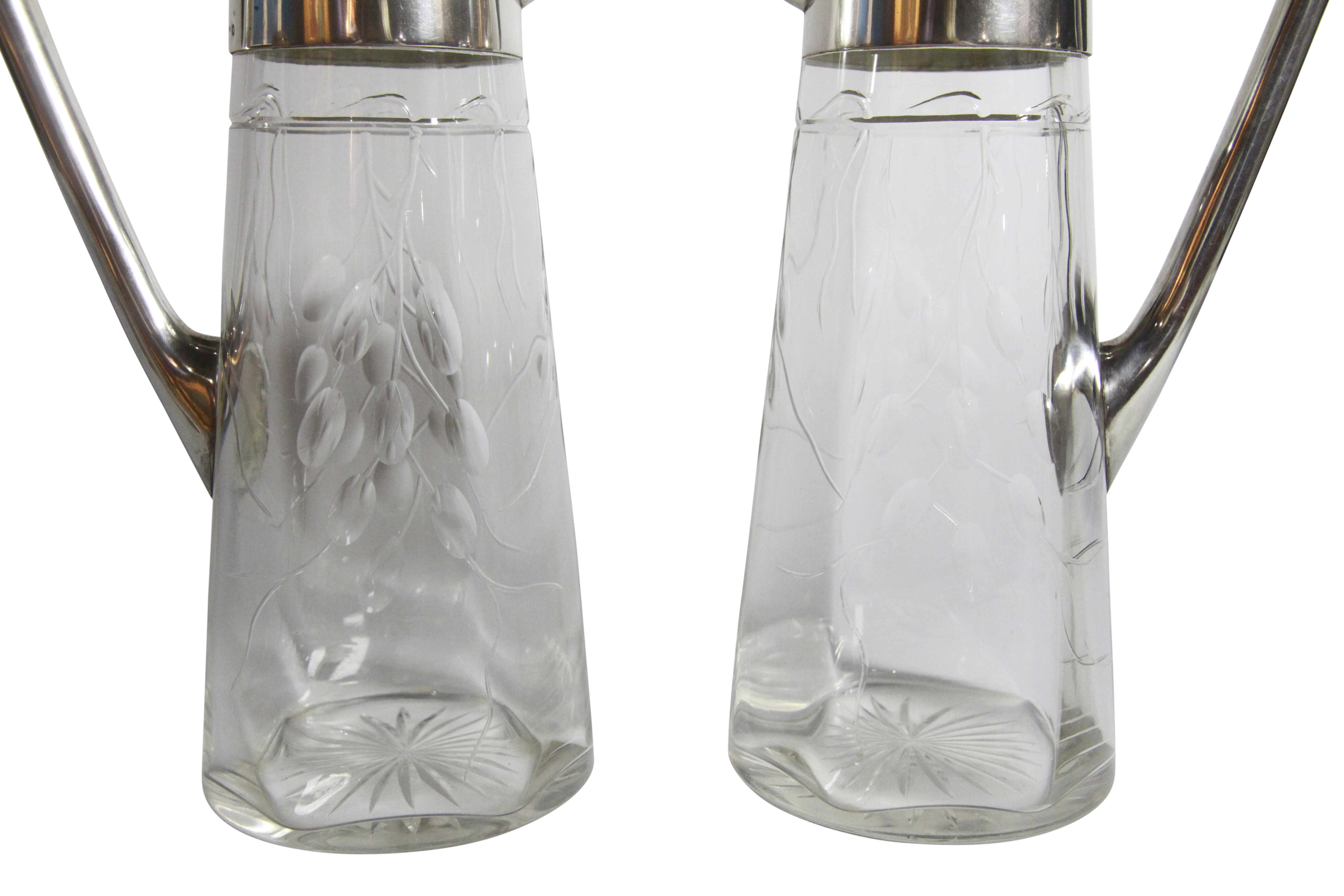 A pair of glass wine decanters with silver handles and lid - Prague 1915. (H: 17cm), PROVENANCE: - Image 2 of 4