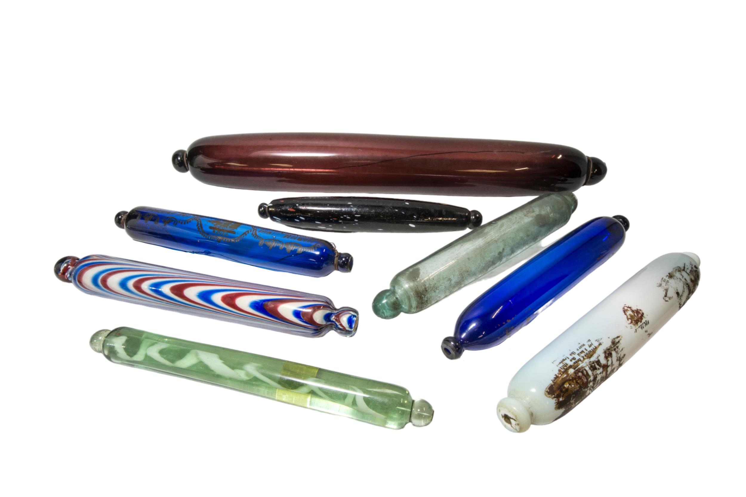 A MIXED GROUP OF 19TH CENTURY GLASS ROLLING PINS, the lot includes a Nailsea rolling pin, a