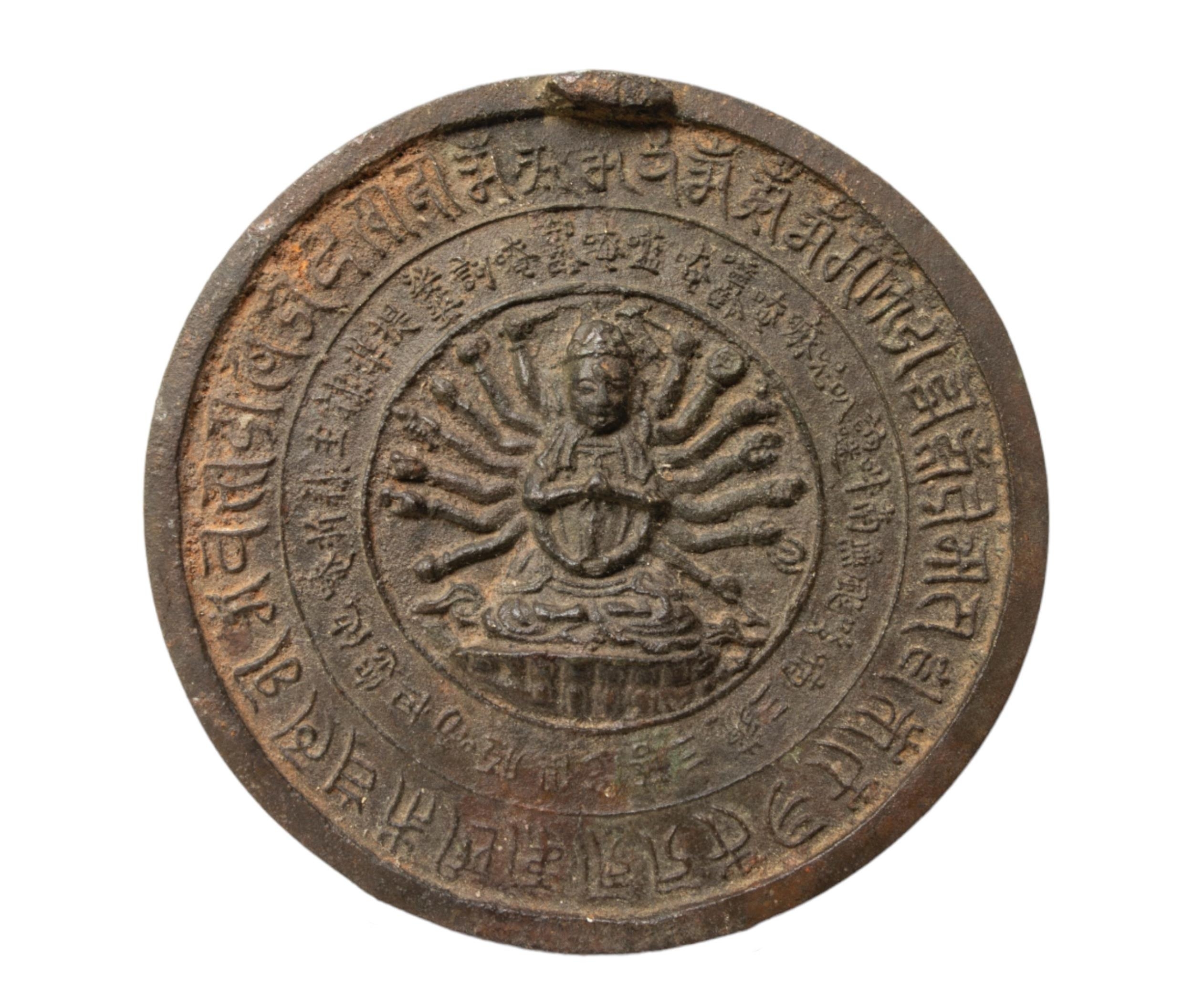 A SINO-TIBETAN BRONZE MIRROR OF AMOGHAPSA, finely cast in relief with the deity in the central