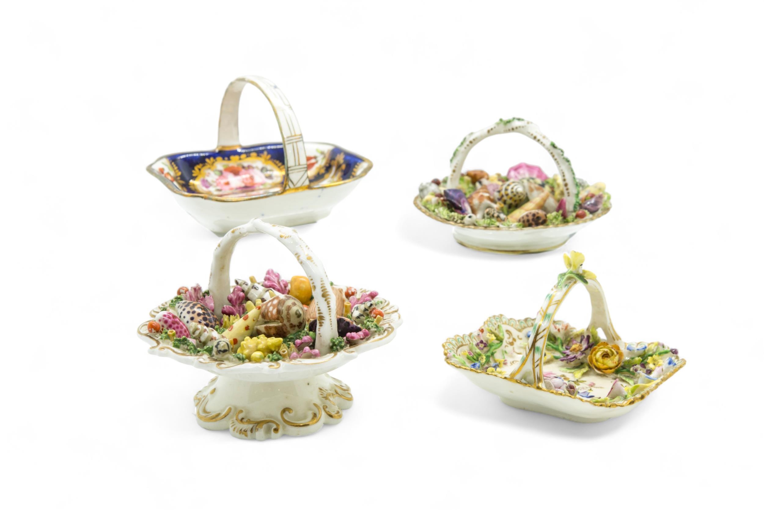 FOUR ENGLISH MINIATURE BASKETS Circa 1840, two with molded shells, one encrusted flowers, the