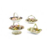 FOUR ENGLISH MINIATURE BASKETS Circa 1840, two with molded shells, one encrusted flowers, the
