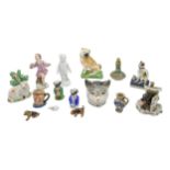 A MIXED GROUP OF SMALL PORCELAIN FIGURES AND TRINKETS, the group includes a Meissen cherubic figure,