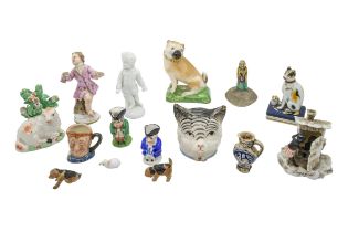 A MIXED GROUP OF SMALL PORCELAIN FIGURES AND TRINKETS, the group includes a Meissen cherubic figure,