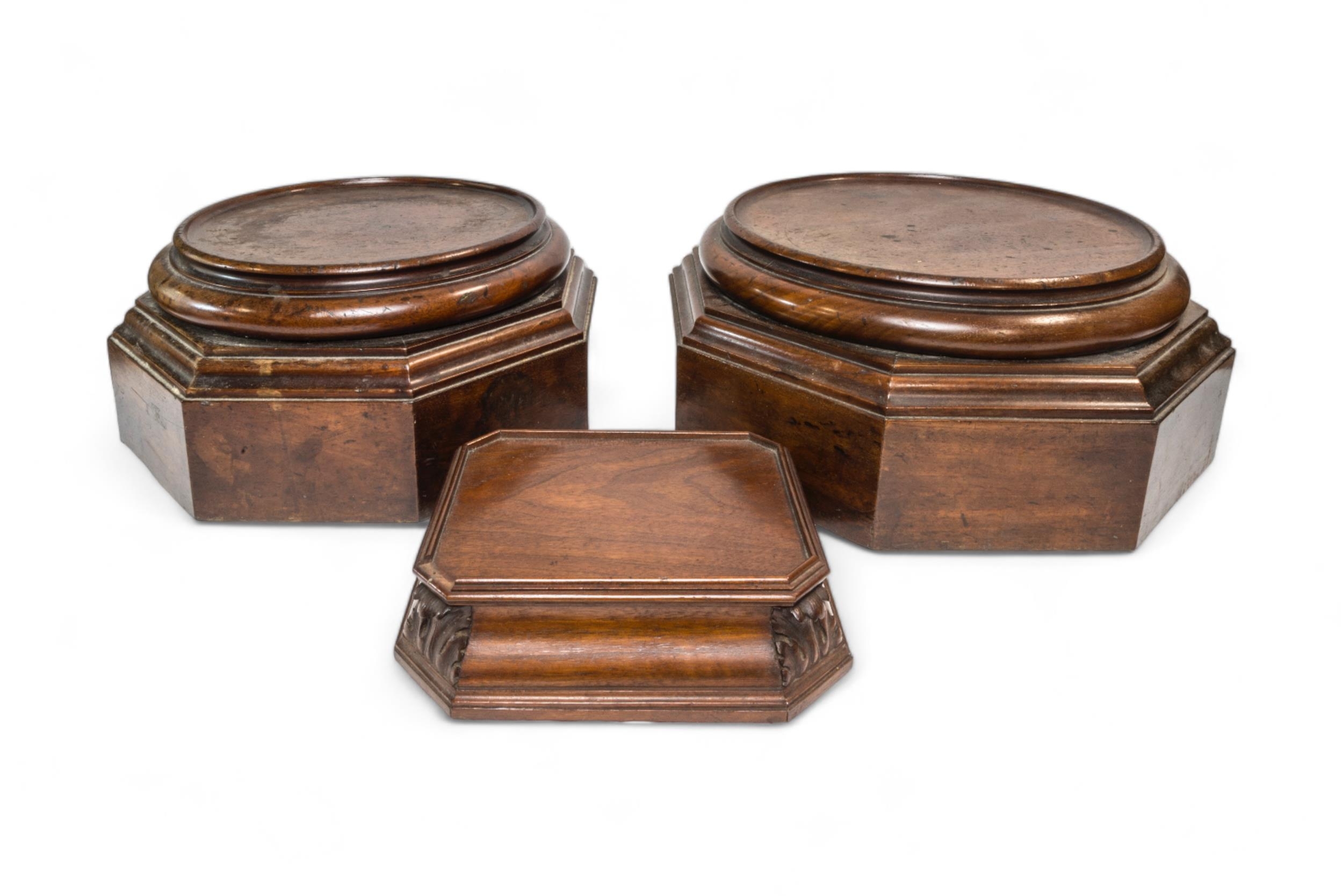 A PAIR OF 19TH CENTURY HEXAGONAL MAHOGANY PLINTHS WITH CIRCULAR TOPS and a small rectangular