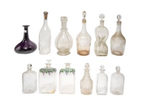 A MIXED GROUP OF ELEVEN VINTAGE GLASS DECANTERS, the lot includes an amethyst glass decanter, two