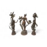 A PAIR OF COPPER ALLOY FRENCH ART NOUVEAU FIGURAL LAMPS AFTER MOREAU ON STONE BASES, and another