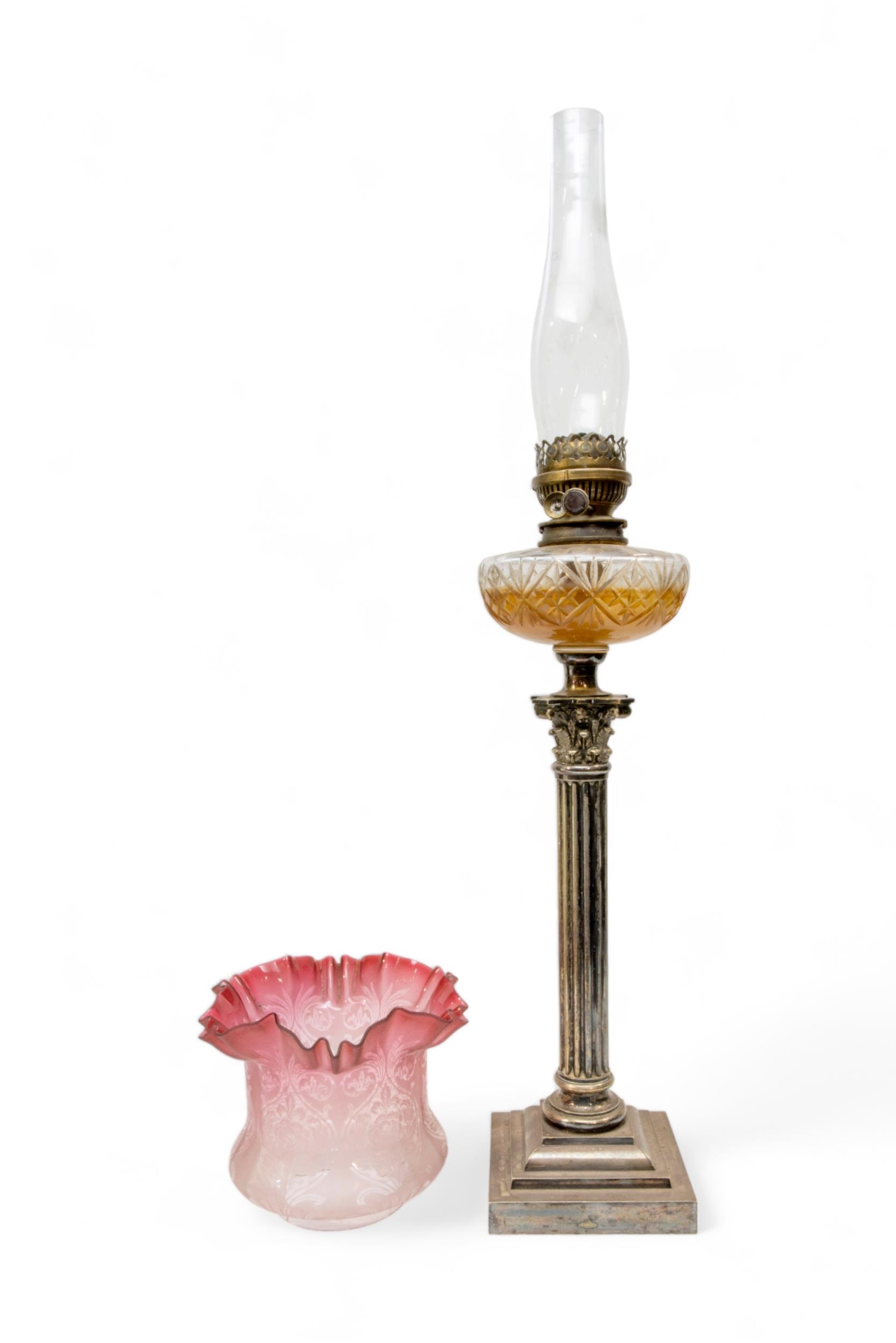 A VICTORIAN OIL LAMP, the silver plated corinthian column base with cut glass reservoir and brass - Image 2 of 2