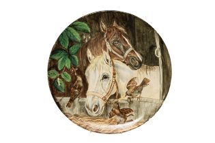 A LARGE HAND PAINTED VINTAGE POTTERY CHARGER, 20TH CENTURY, decorated with a depiction of two horses