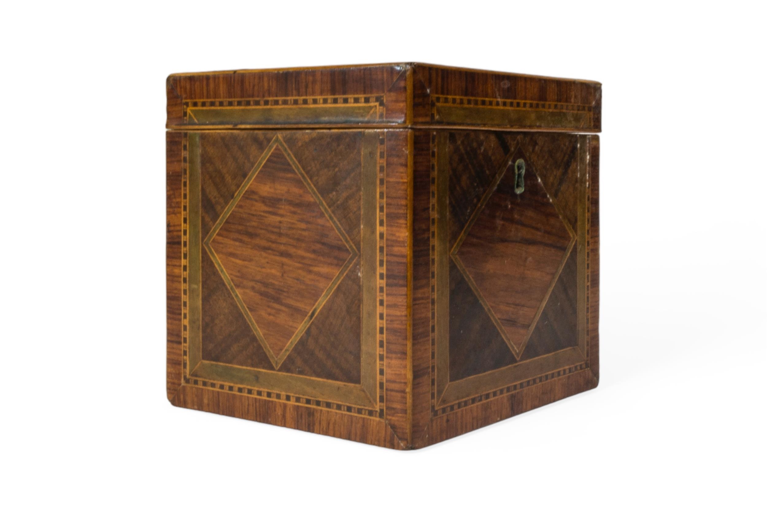 A GEORGE III TEA CADDY OF CUBE FORM, variously inlaid with various woods, each face with a diamond