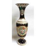 A GREEN GLASS ENAMELLED VASE Mid 19th century, 35cms high