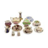 A COLLECTION OF MINIATURES A Spode claret ground jug with raised paste gilding, a teapot, two