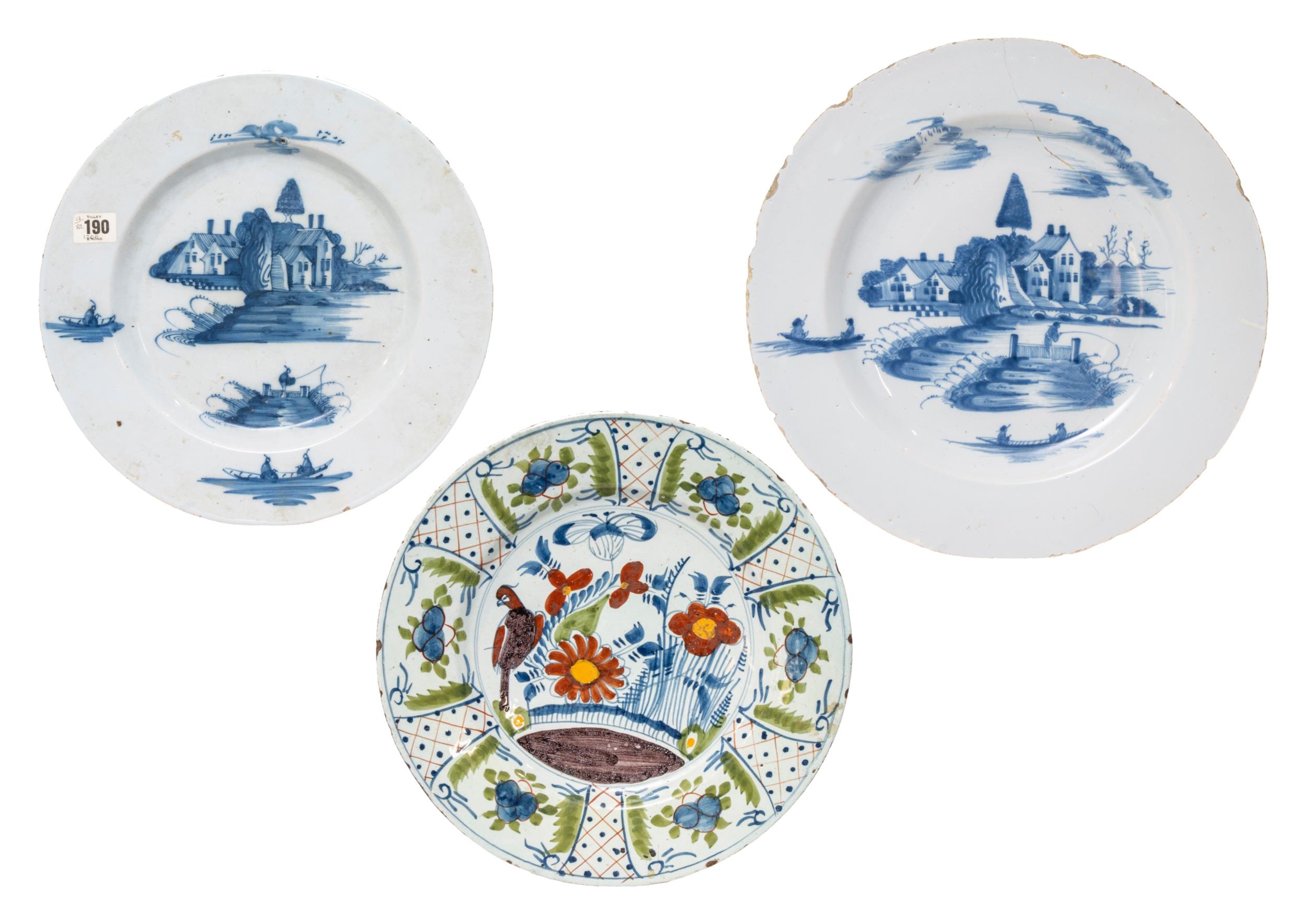 THREE LARGE DELFT DISHES, 18TH CENTURY, consisting of two dishes painted with traditional rural