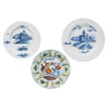 THREE LARGE DELFT DISHES, 18TH CENTURY, consisting of two dishes painted with traditional rural