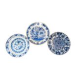 A GROUP OF THREE DUTCH DELFT DISHES, 18TH CENTURY, the lot includes one painted with a profusion