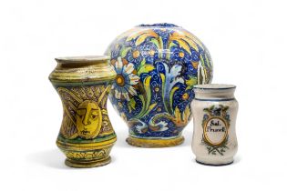 A FAIENCE DRUG JAR 16th/ 17th century, and two further jars, one dated 1794, 26cms high