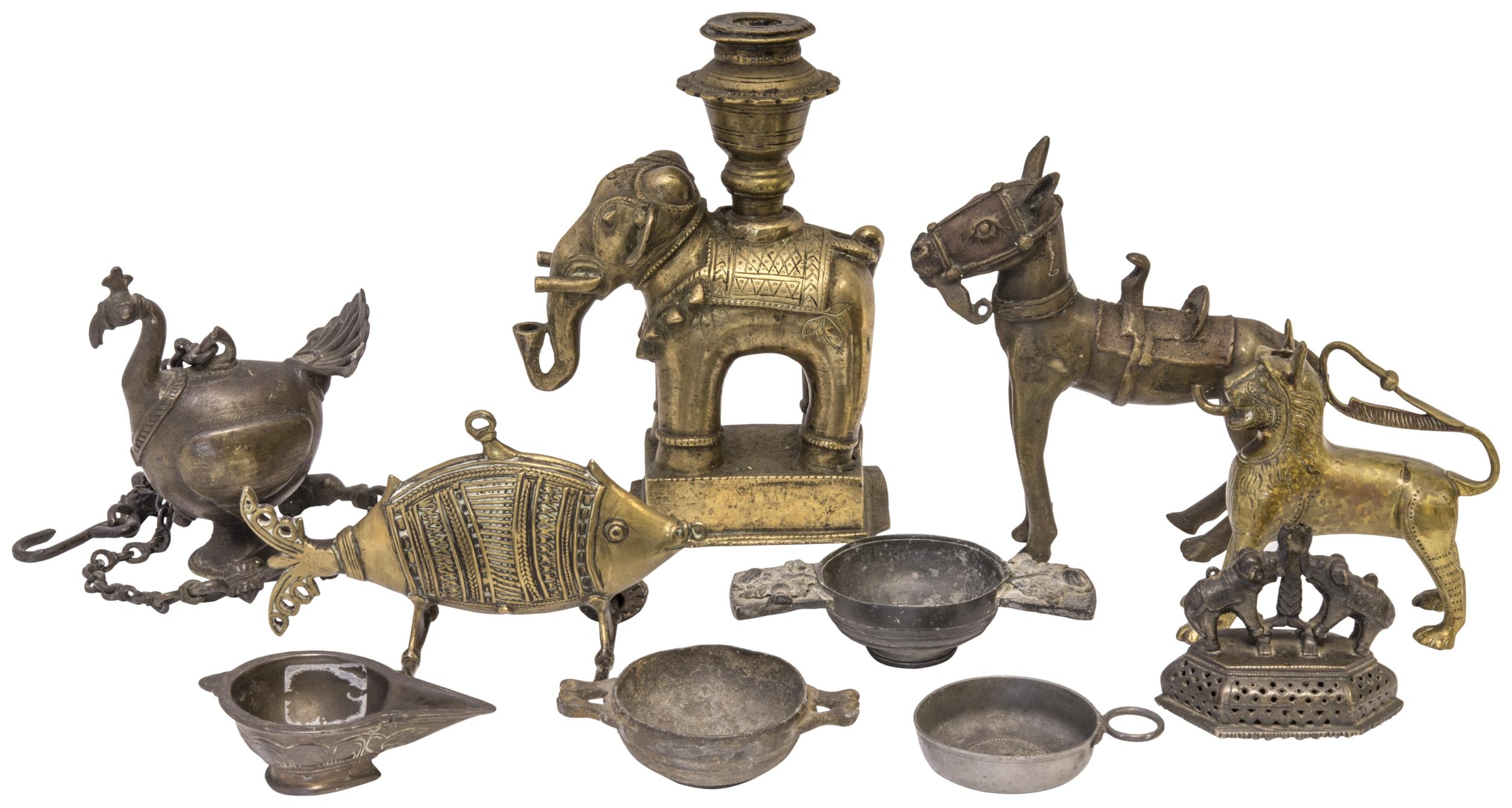 AN INDIAN COPPER ALLOY ELEPHANT ‘CANDLESTICK’, a horse, a wheel-along-fish, an oil lamp, and other