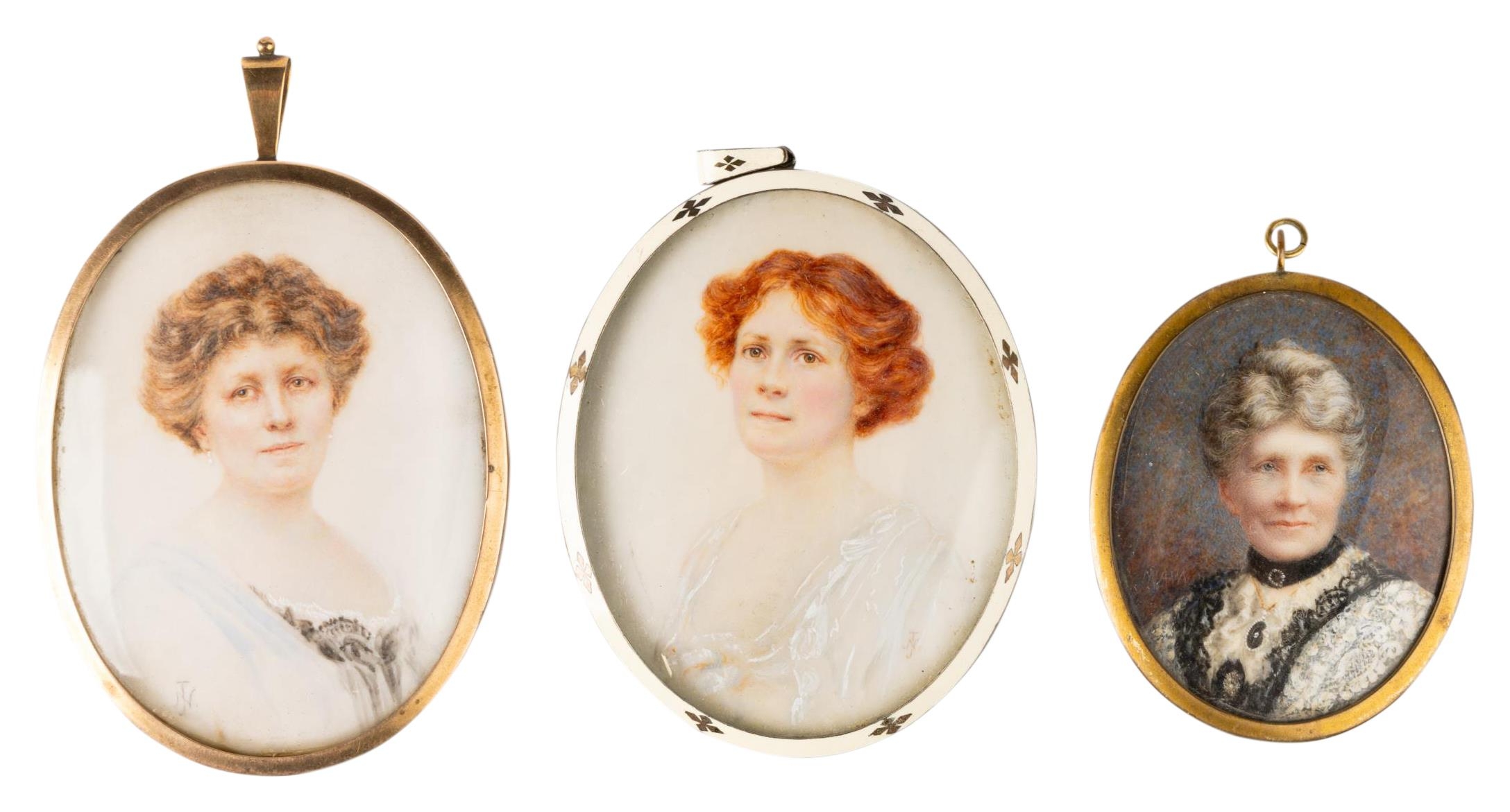 AN EDWARDIAN MINIATURE OF A RED HAIRED WOMAN, in a white metal and enamel frame, another in a 9ct