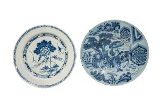 FIVE TIN GLAZED CHARGERS 18th century, including a Bristol example in the Niglet style, 33cms wide