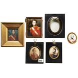 AN EARLY 19TH CENTURY PORTRAIT MINIATURE OF AN OFFICER, in an oval gilt mount ad paper mache frame