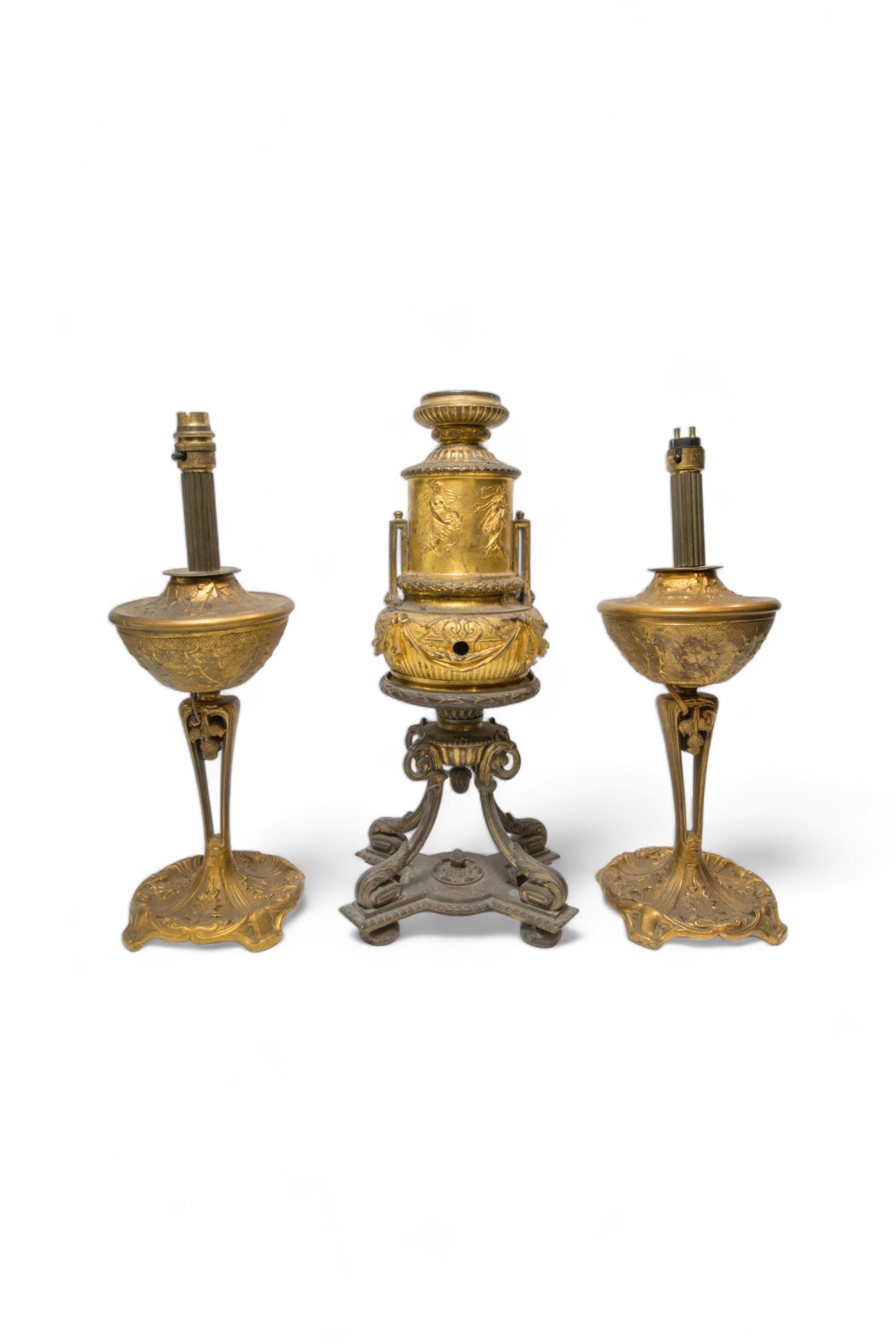 A PAIR OF BRASS OIL LAMP BASES DECORATED WITH HOLLY AND THISTLES, early 20th century and later