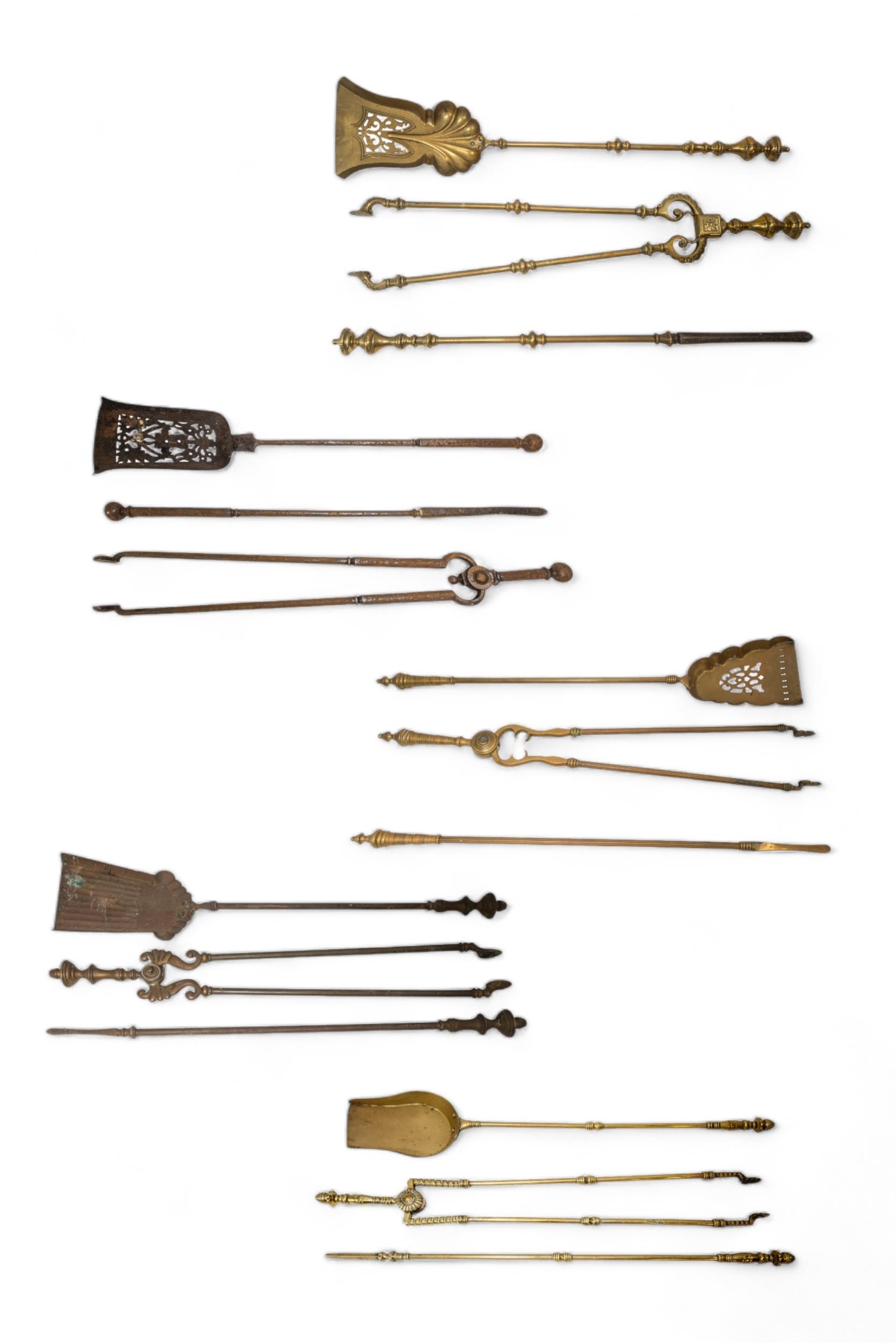 A SET OF 19TH CENTURY BRASS FIRE IRONS, two other sets and two steel sets.