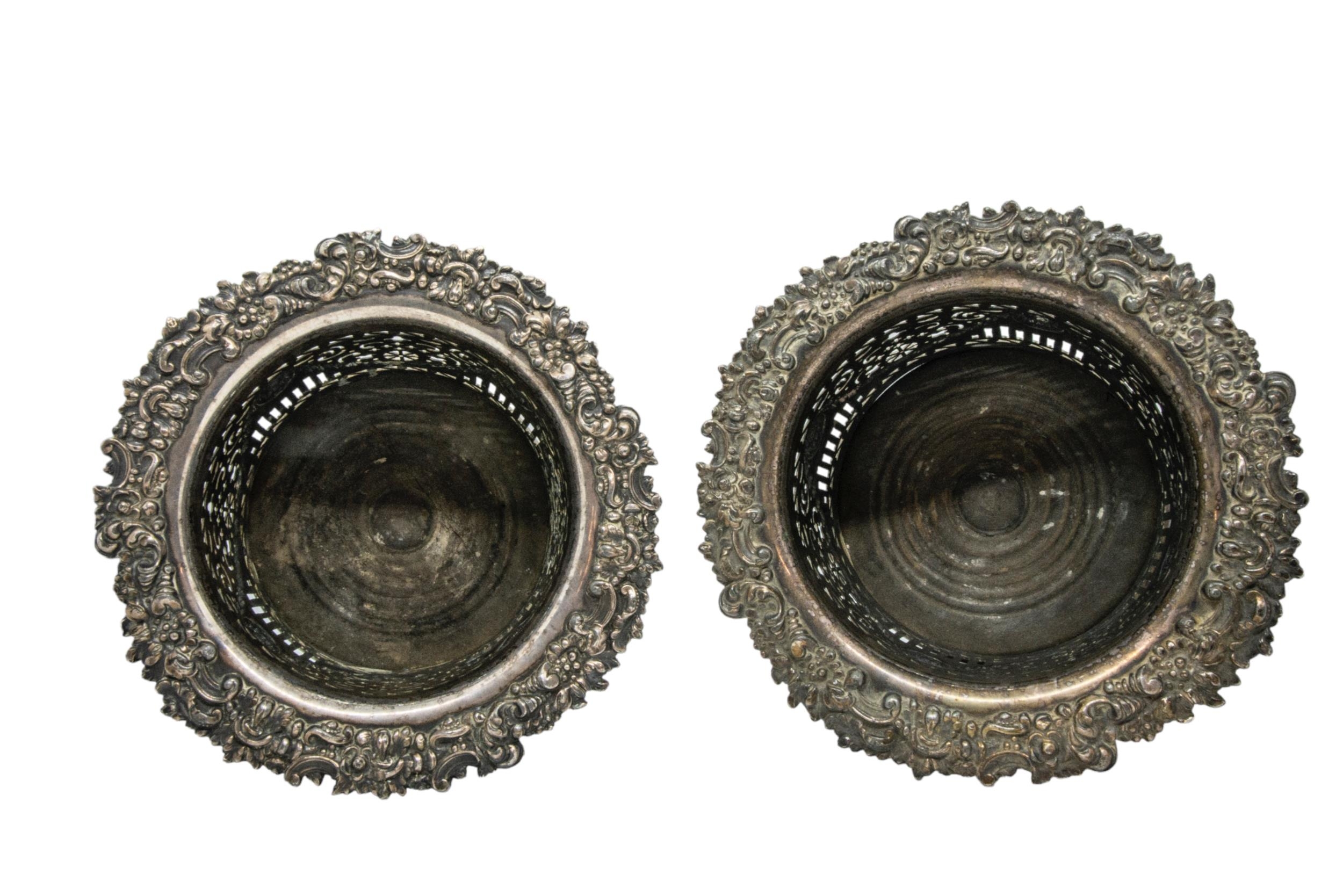 A PAIR OF VINTAGE WHITE METAL WINE BOTTLE HOLDERS, the handle and collar modelled as fruiting vines, - Image 2 of 3
