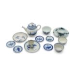 A GROUP OF BLUE AND WHITE MINIATURES Mid 18th century, a teapot, five miniature plates (one
