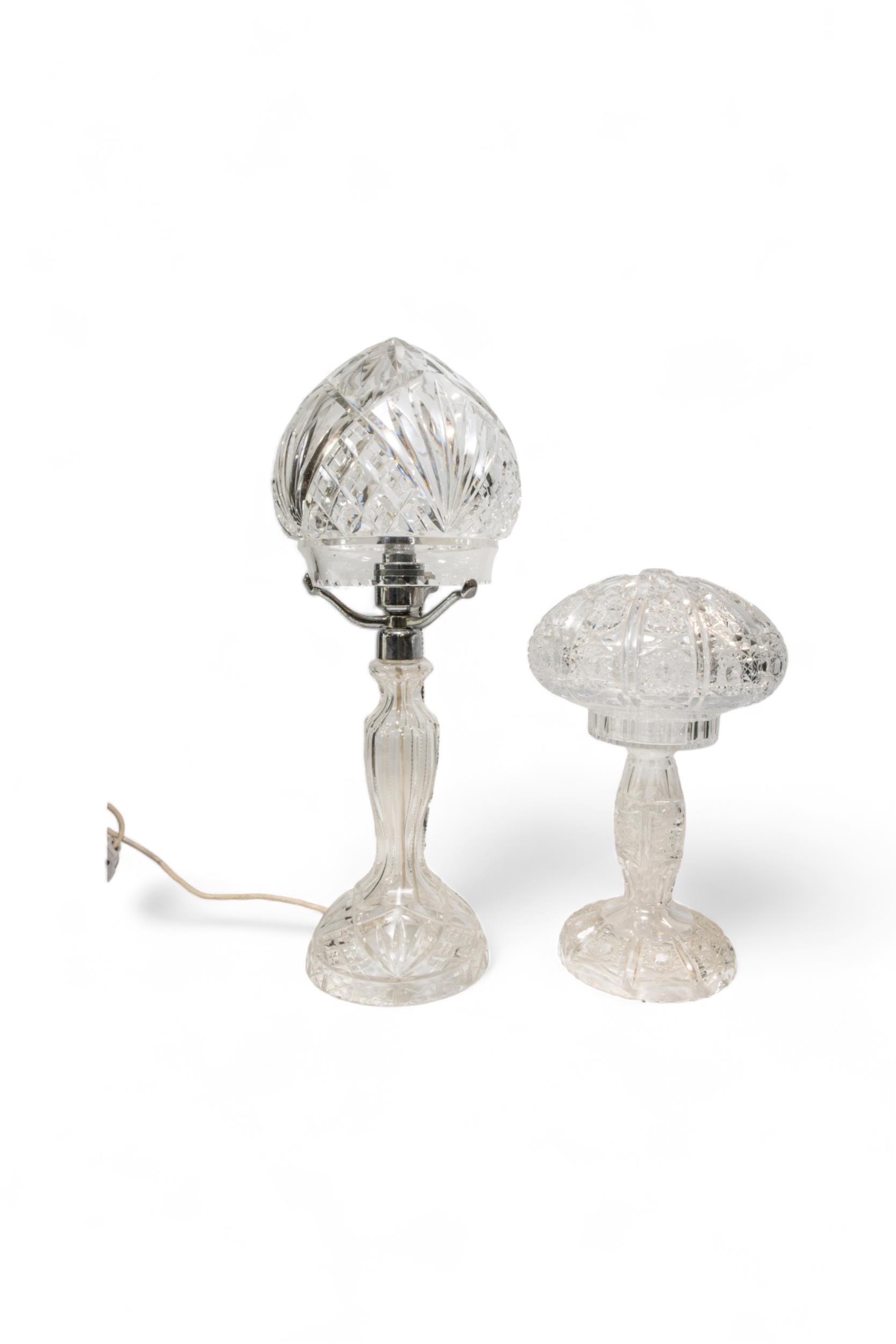 A CUT GLASS TABLE LAMP OF MUSHROOM FORM the shade seated on a chromium mount and another cut glass