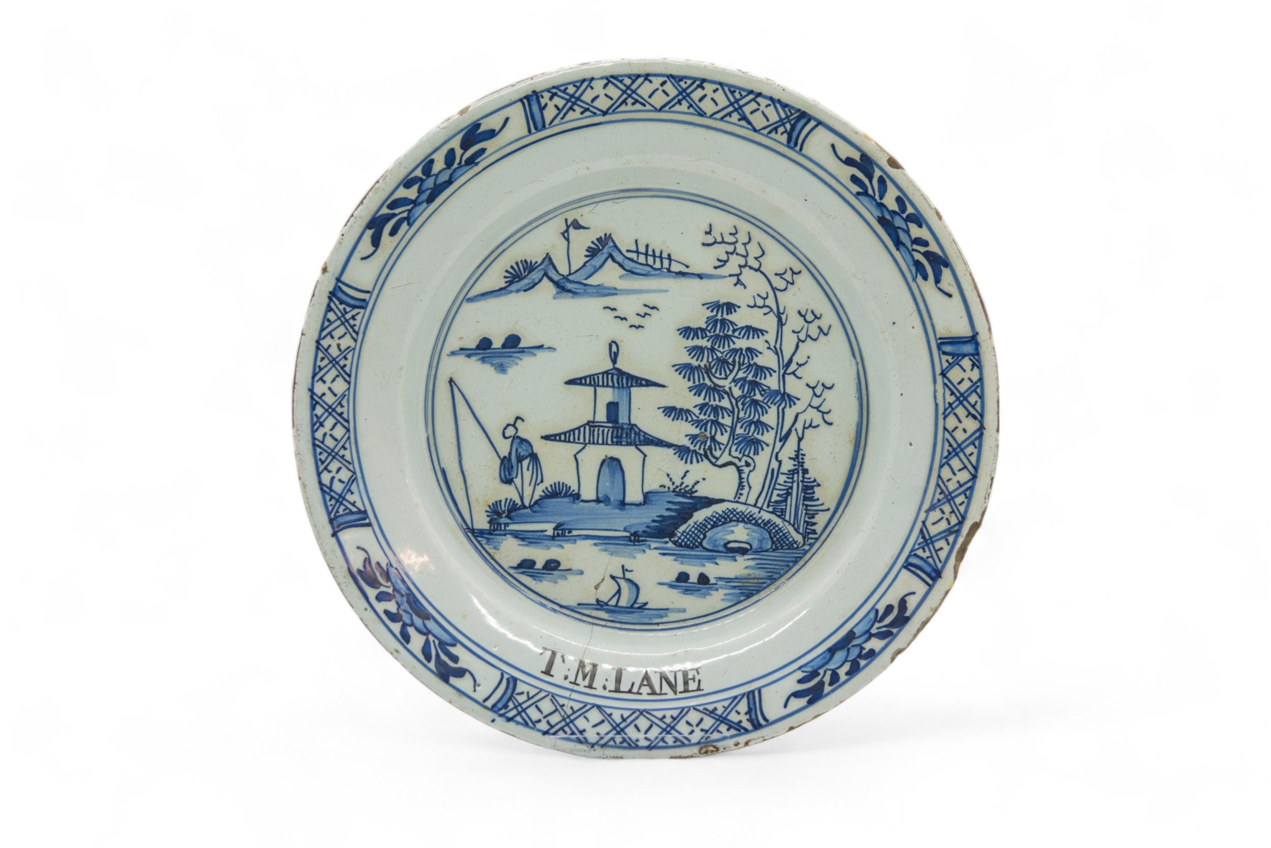 SIX DELFT PLATES 18th Century, one inscribed "T.M.LANE", 23cms wide