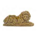 A RARE RECUMBENT STAFFORDSHIRE LION Circa 1830, 16cms wide