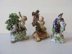 A BOW BOCAGE FIGURE OF A CUPID WITH DOG, together with another cupid bocage figure and a figurine